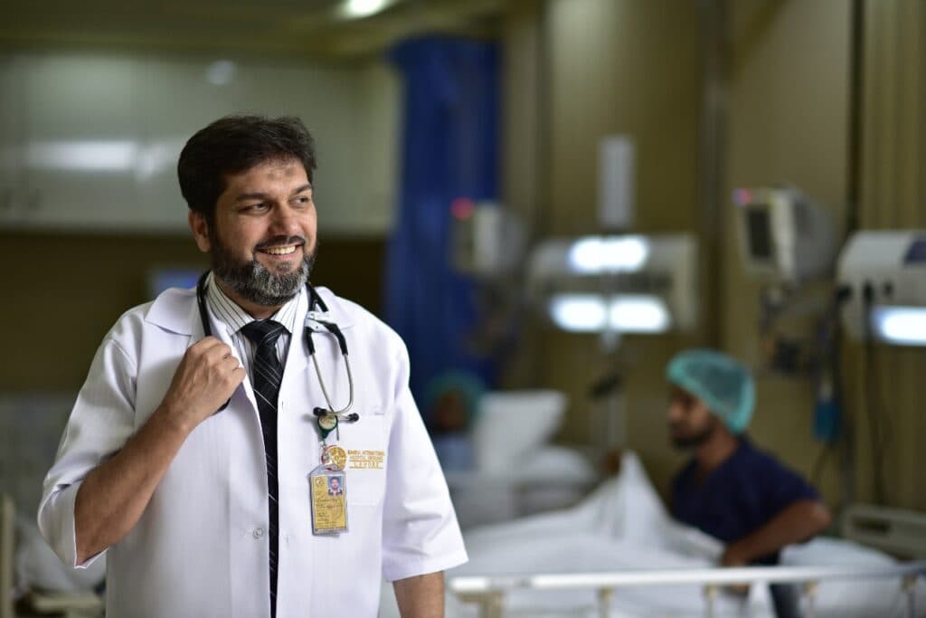Dr. Asim Rana in white coat at Bahria International Hospital ICU