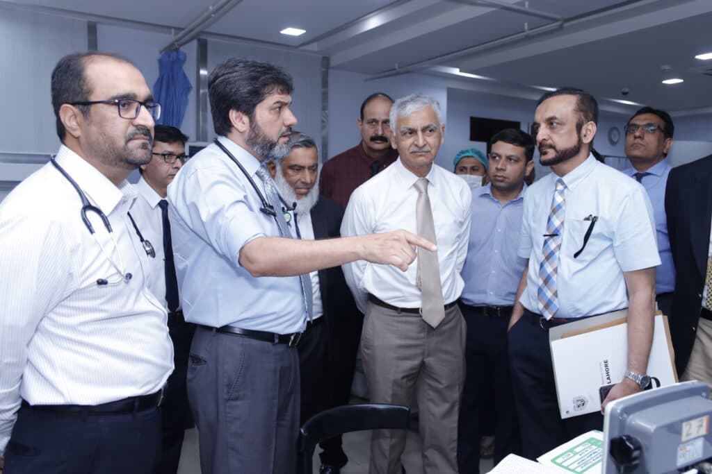 Dr. Asim Rana leading a grand round with the medical team