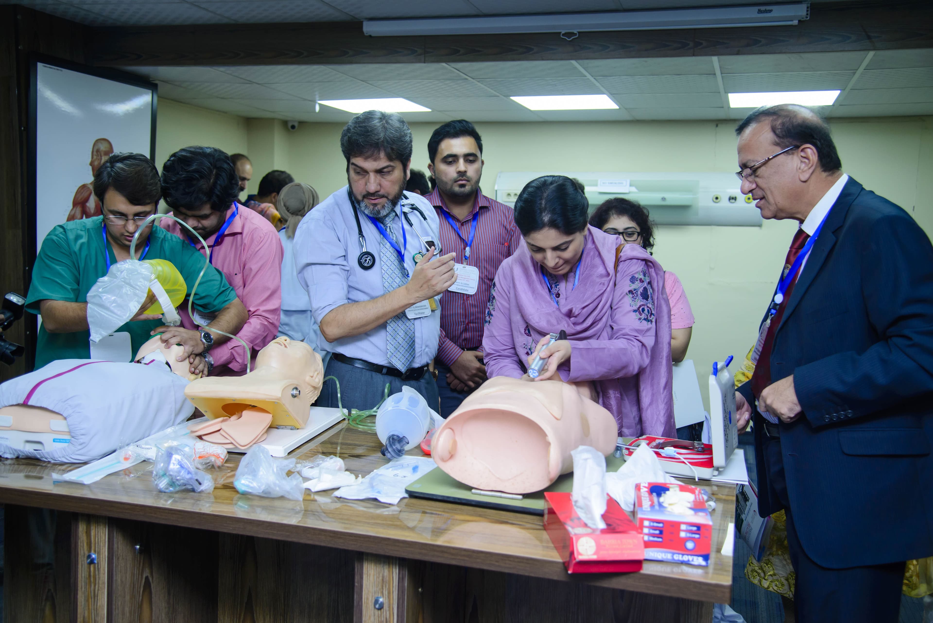 Dr. Asim Rana demonstrating airway management techniques during a training workshop