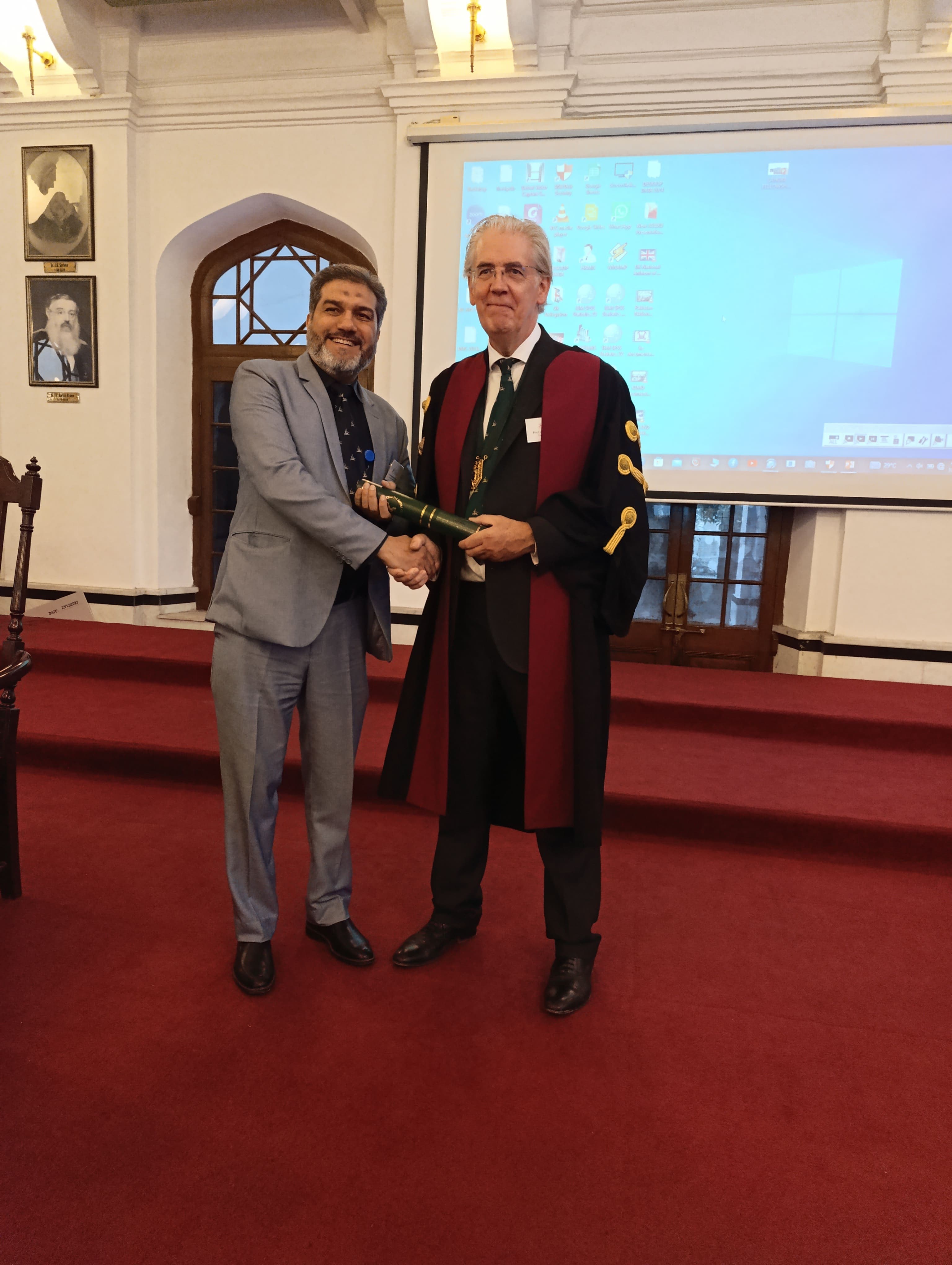 Dr. Asim Rana in a group photograph at a fellowship ceremony