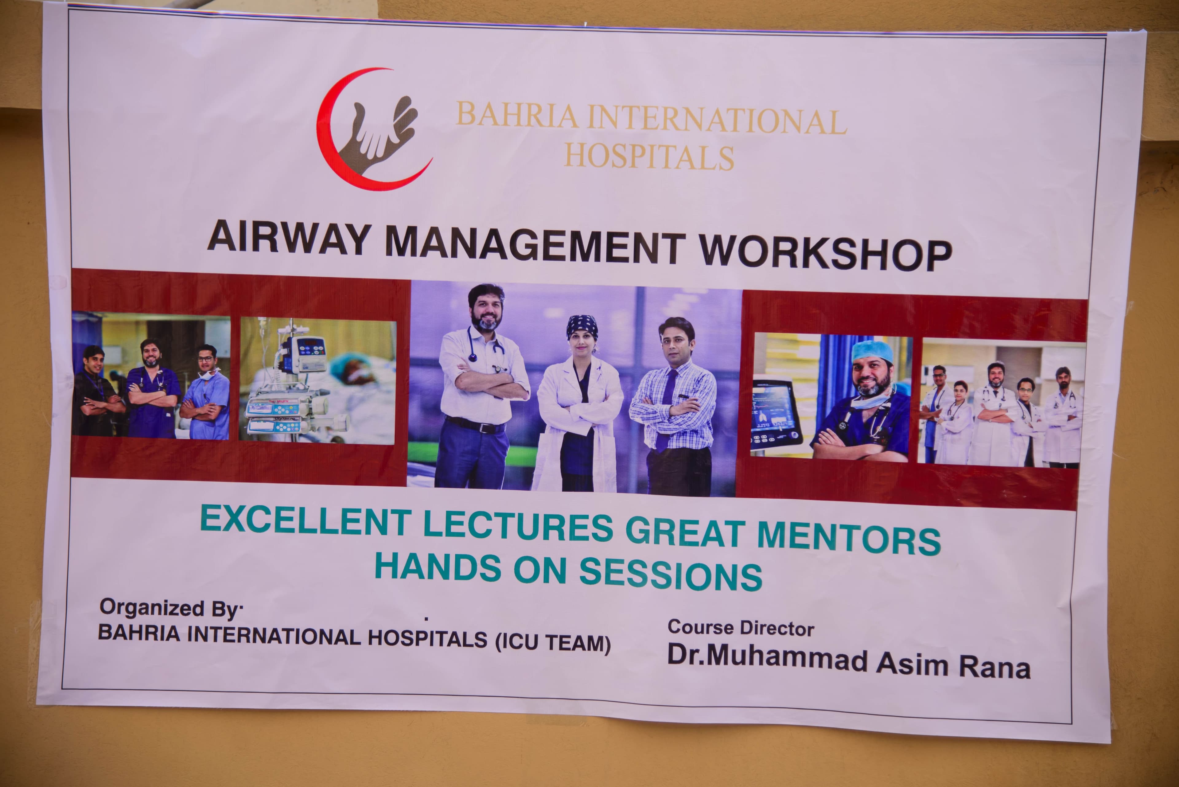 Dr. Asim Rana with residents and fellows at a teaching session