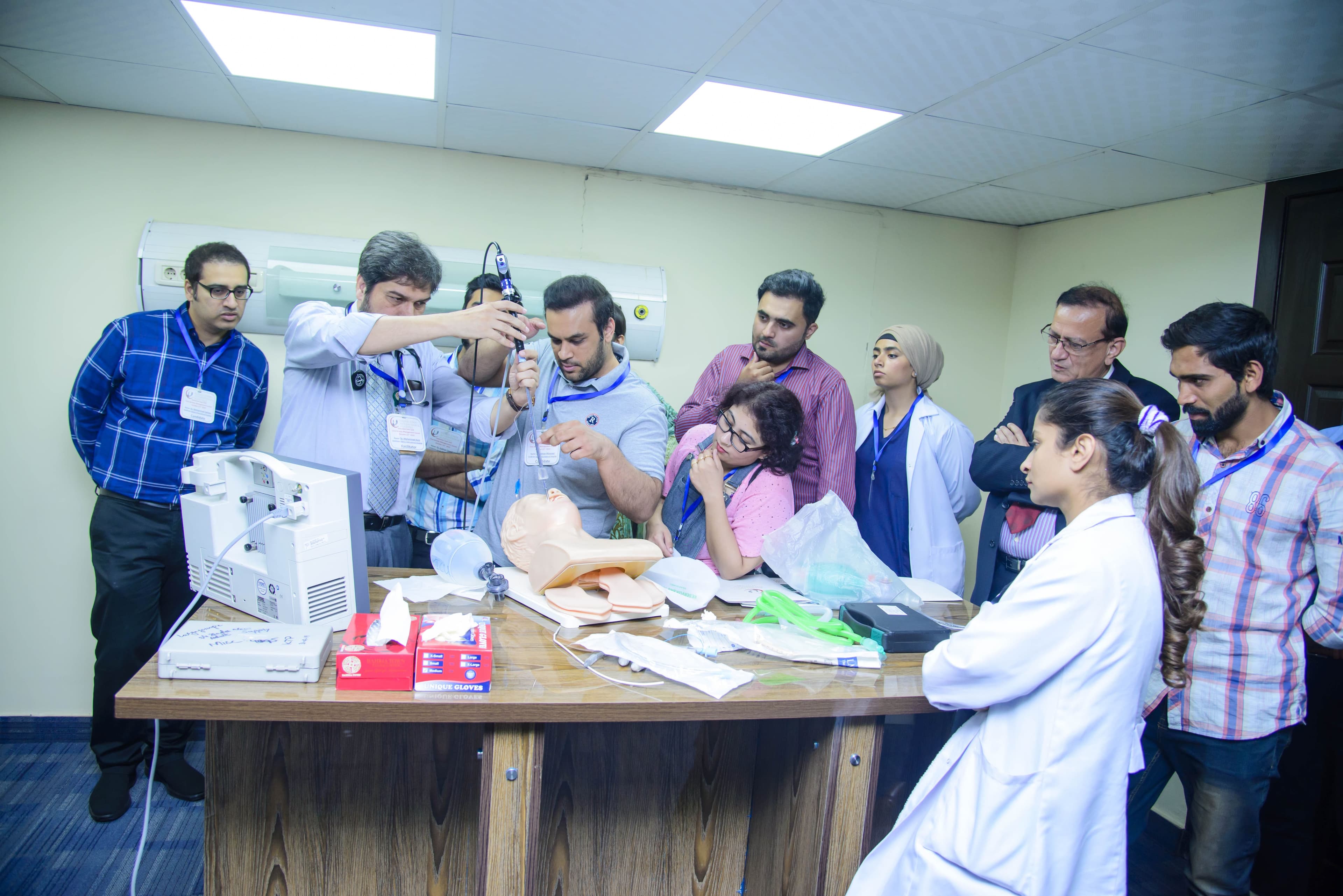 Dr. Asim Rana leading a practical training session on critical care procedures