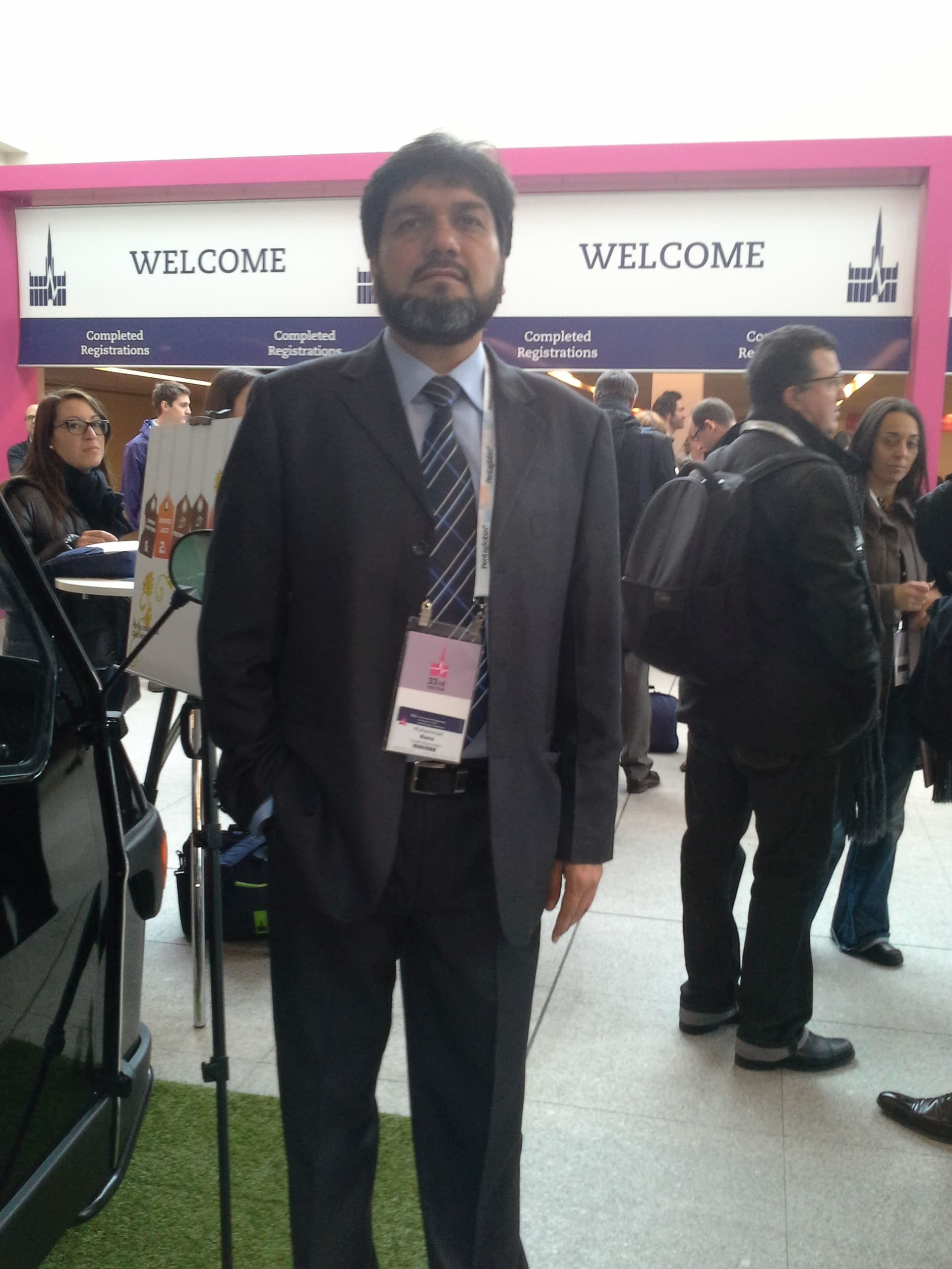 Dr. Asim Rana in formal attire at a medical academic gathering