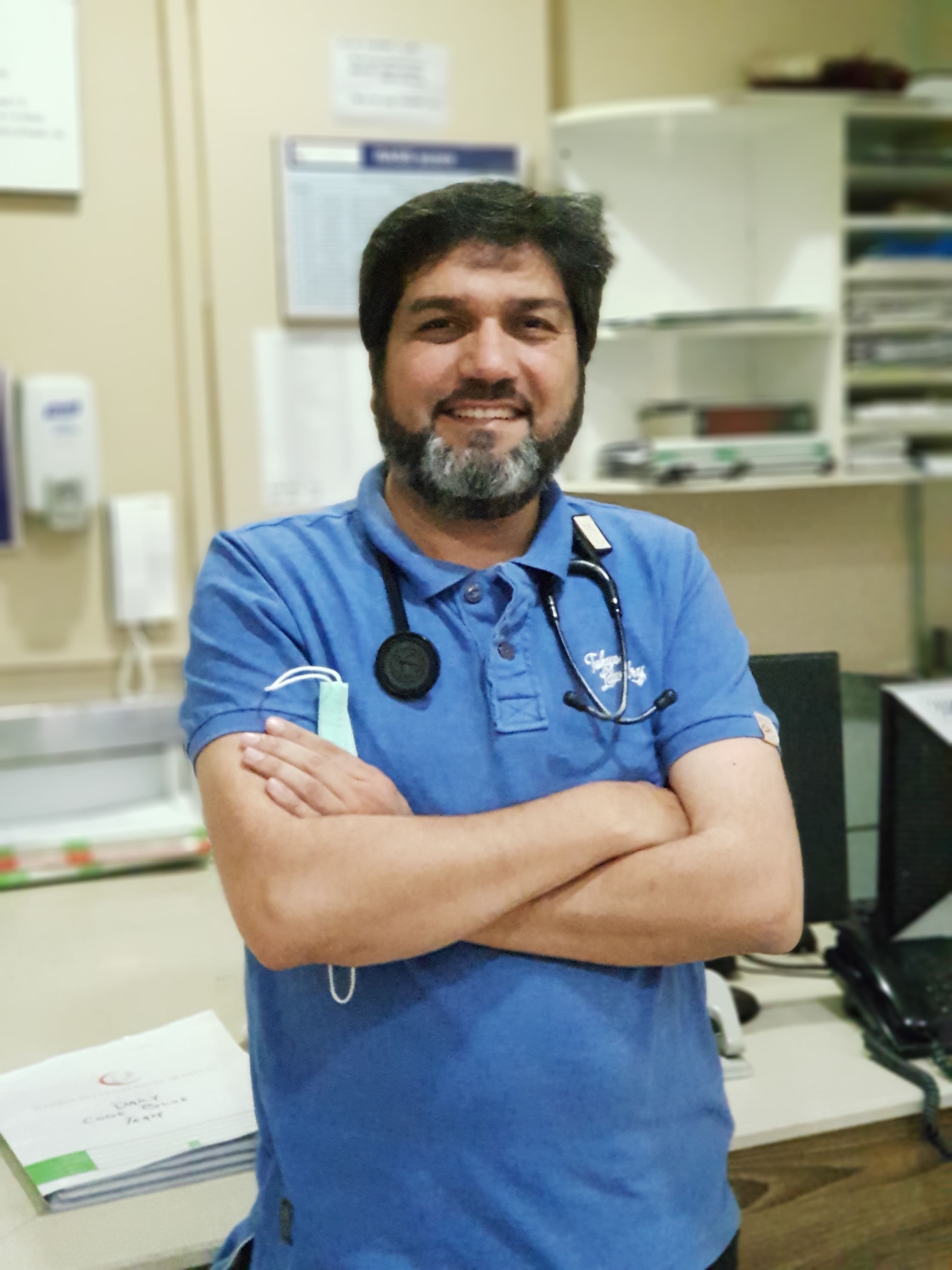Dr. Asim Rana in the ICU with a stethoscope